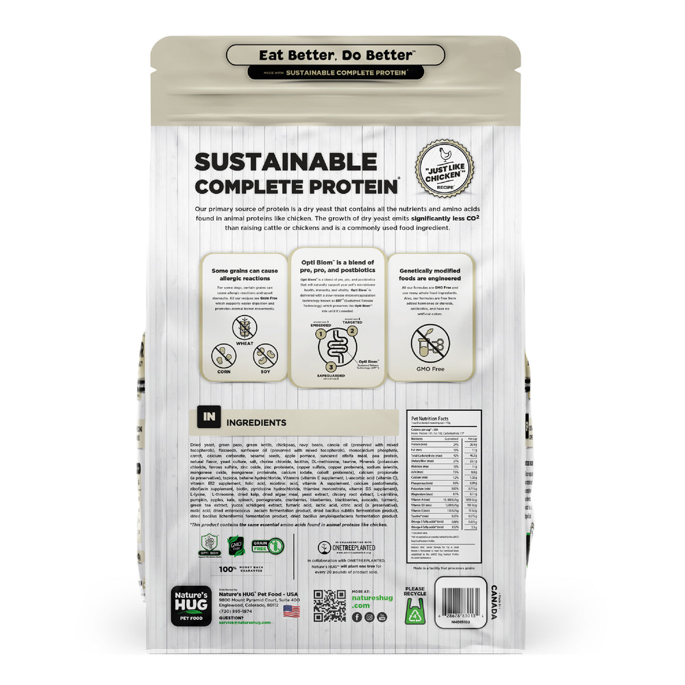 Back view of a Nature's Hug Adult, Supports Vitality Formula Dog Food for Toy & Small Breeds bag. The package features the 'Sustainable Complete Protein' label with a green header and the slogan 'Eat Better. Do Better.' Icons highlight the plant-based, non-GMO protein source. Additional details include allergen information, nutrients, and the claim of being similar to chicken. The back lists ingredients and nutritional facts.