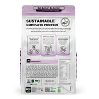 Back view of a Nature's Hug Adult, Overall Health & Wellness Formula Dog Food for Medium & Large Breeds bag. The package features the 'Sustainable Complete Protein' label with a green header and the slogan 'Eat Better. Do Better.' Icons highlight the plant-based, non-GMO protein source. Additional details include allergen information, nutrients, and the claim of being similar to chicken. The back lists ingredients and nutritional facts.