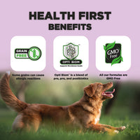 A playful brown dog runs across a green field beneath a pastel purple background. The image features the text "HEALTH FIRST BENEFITS" at the top. Three icons are displayed: the first states "Grain Free," with a note about allergic reactions; the second highlights "Opti Biom," which supports microbiome health; and the third notes that all formulas are "GMO Free."