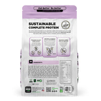 Back view of a Nature's Hug Adult, Overall Health & Wellness Formula Dog Food for Toy & Small Breeds bag. The package features the 'Sustainable Complete Protein' label with a green header and the slogan 'Eat Better. Do Better.' Icons highlight the plant-based, non-GMO protein source. Additional details include allergen information, nutrients, and the claim of being similar to chicken. The back lists ingredients and nutritional facts.