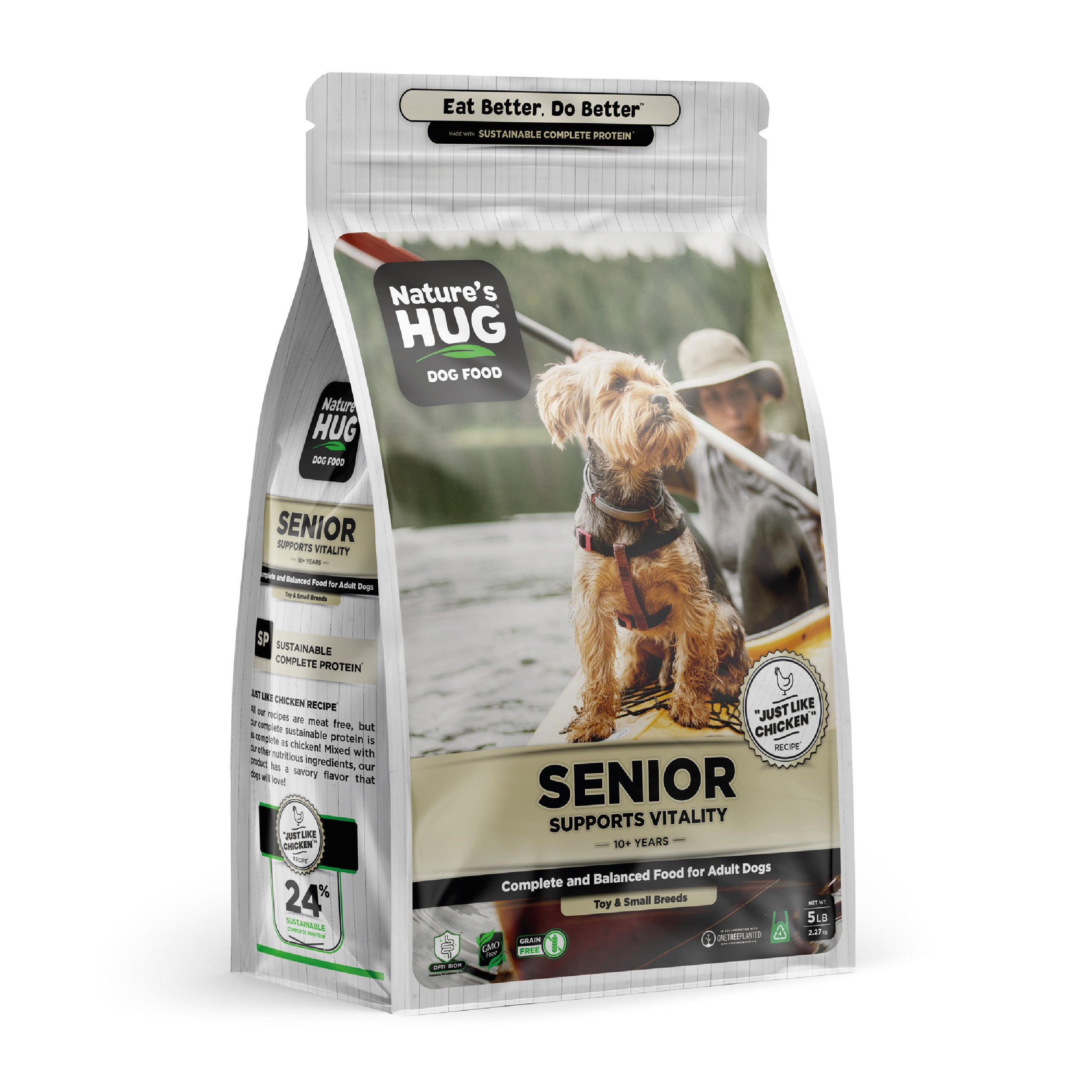 A bag of Adult, Supports Vitality Formula Dog Food for Toy & Small Breeds Nature's Hug dog food  is displayed. The front features the title “SENIOR SUPPORTS VITALITY” and highlights that it’s suitable for dogs aged 10 years and older. A small dog stands beside the bag, portrayed outdoors near a person in a hat.